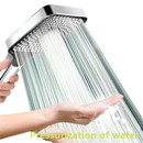 Chrome shower head with pressurized water flow.