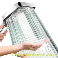 Chrome shower head with pressurized water flow.