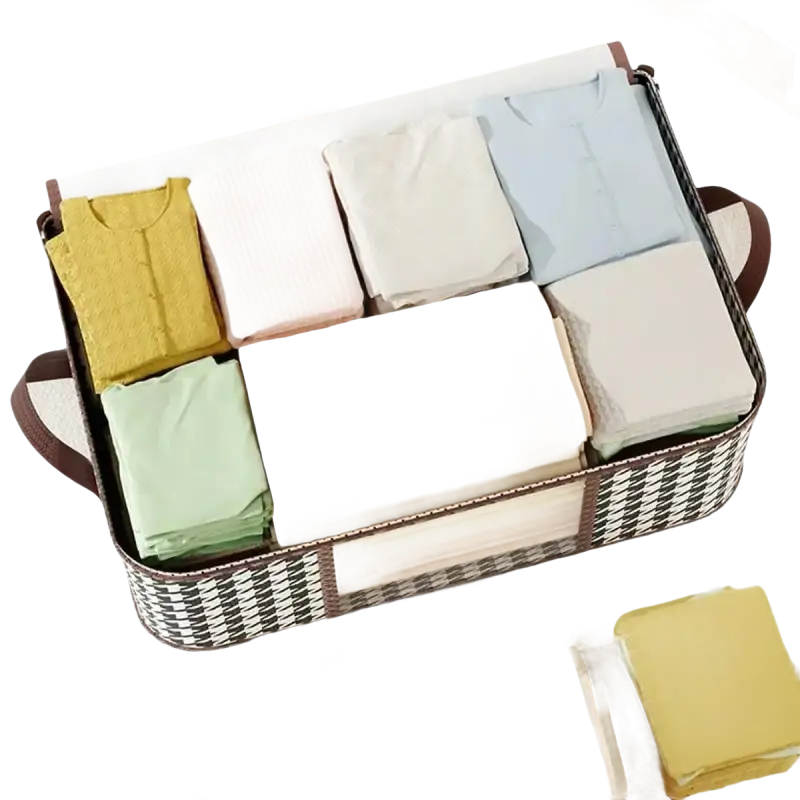 Fabric storage basket with folded clothes.