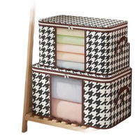 Two houndstooth storage boxes.