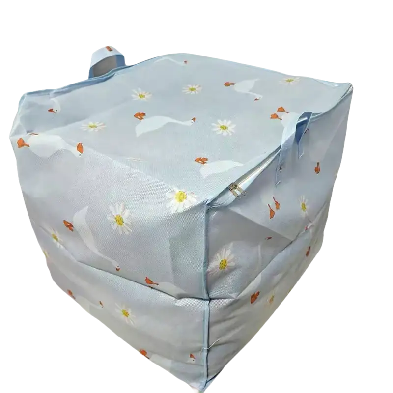 Blue storage cube with swan and daisy pattern.