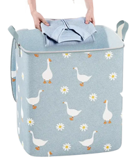 Goose and daisy patterned laundry hamper.