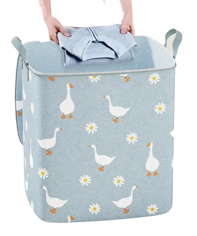 Goose and daisy patterned laundry hamper.