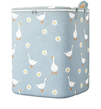 Goose and daisy patterned laundry hamper.