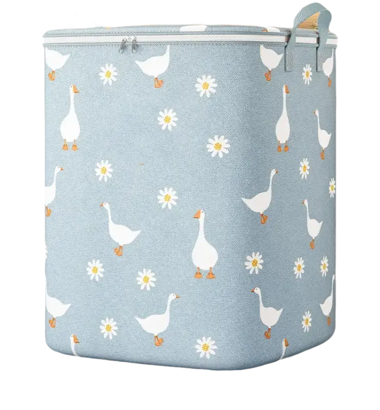 Goose and daisy patterned laundry hamper.