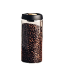 Coffee bean-filled glass jar with black lid.
