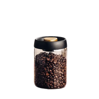 Glass jar filled with coffee beans.
