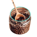 Coffee beans in a glass jar with a wooden spoon.