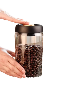 Glass jar filled with coffee beans.