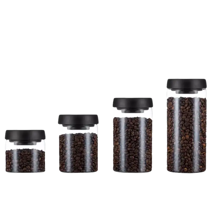 Glass storage jars with black lids.
