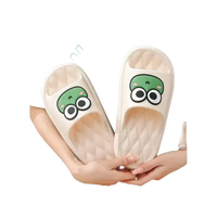 Frog-faced beige slippers.