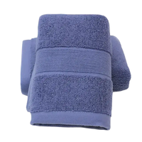 Folded blue trendy cotton towel bathroom with softabsorb cotton face feel