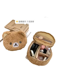 Fuzzy bear-shaped makeup bag.