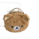 Fuzzy brown bear-shaped handbag.