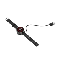 Black smartwatch on charging dock.