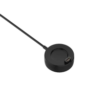 Black circular charging dock with cable.