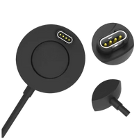 Black charging puck with gold-plated pins.