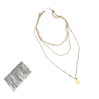 Gold layered necklace with a circular pendant.