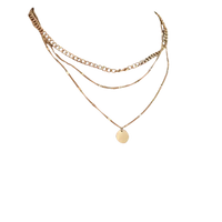 Layered gold-tone necklaces.