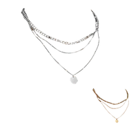 Layered silver necklace with pendant.