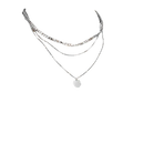 Layered silver necklaces.