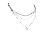 Layered silver necklaces.