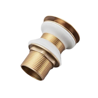 Brass and white sink drain.