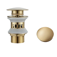 Brushed gold bathroom sink drain.