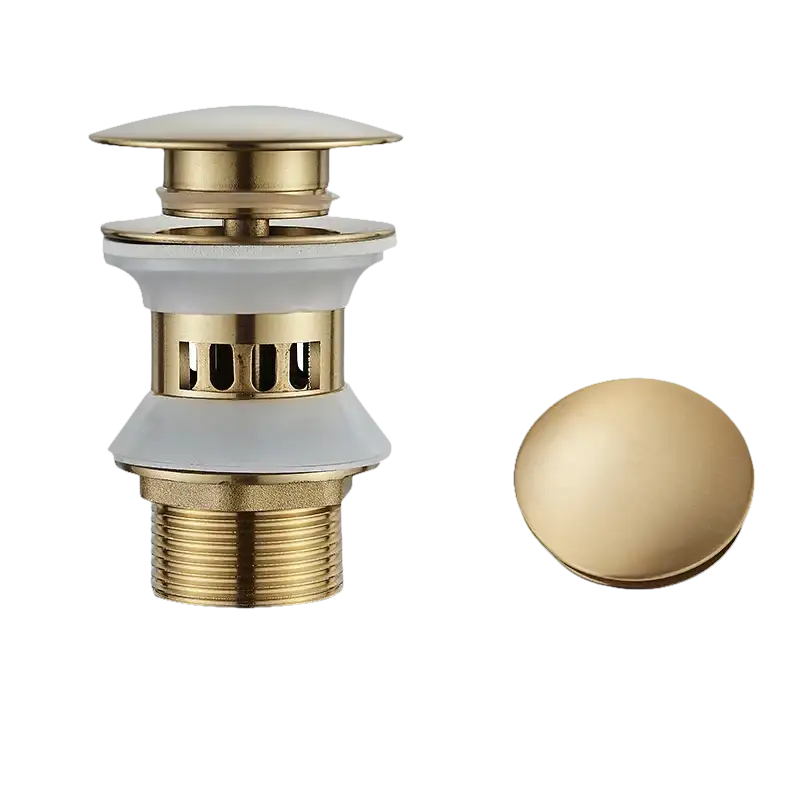 Brushed golden sink drain assembly.