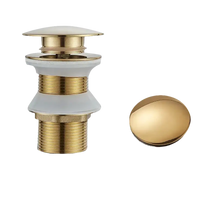 Gold-colored sink drain assembly.