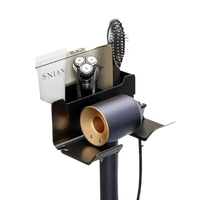 Black wall-mounted hair dryer and accessories organizer.