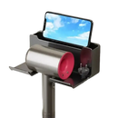 Wall-mounted hair dryer holder with phone slot.