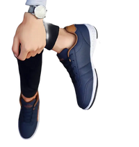 Navy blue leather sneakers.
