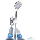 Chrome shower head with adhesive mount.