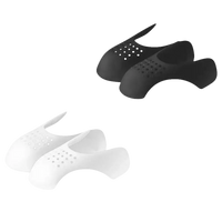Black and white perforated shoe inserts.