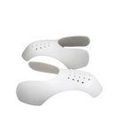 White perforated shoe inserts.