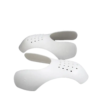 White perforated shoe inserts.