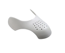 White shoe shield with ventilation holes.