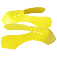 Yellow shoe shields with ventilation holes.
