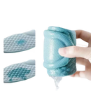 Absorbent sock being squeezed.
