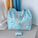 Light blue cartoon-patterned tote bag.