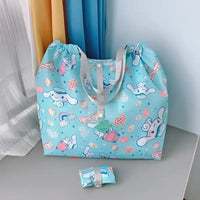 Light blue cartoon-patterned tote bag.
