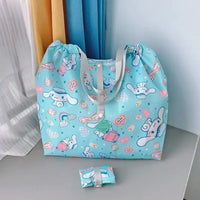 Light blue cartoon-patterned tote bag.