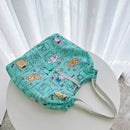 Turquoise cartoon-patterned tote bag.