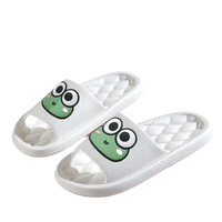 White frog-themed slippers.