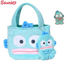 Turquoise plush Hangyodon tote bag with charm.