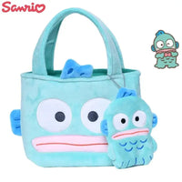 Turquoise plush Hangyodon tote bag with charm.