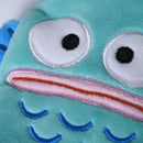 Turquoise plush toy face.