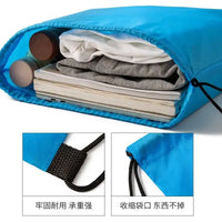 Blue drawstring bag filled with items.