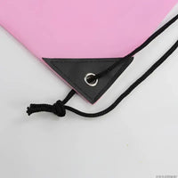 Pink drawstring bag corner.